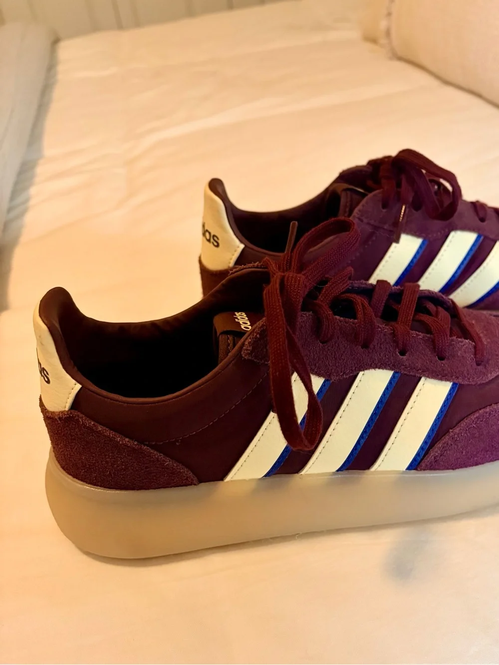 adidas burgundy and white suede sneakers with blue stripe accents